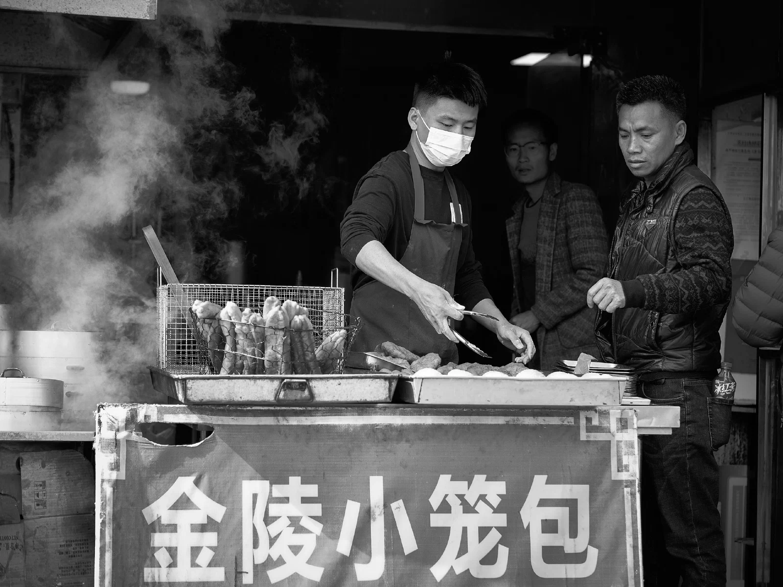 People and stalls by the street