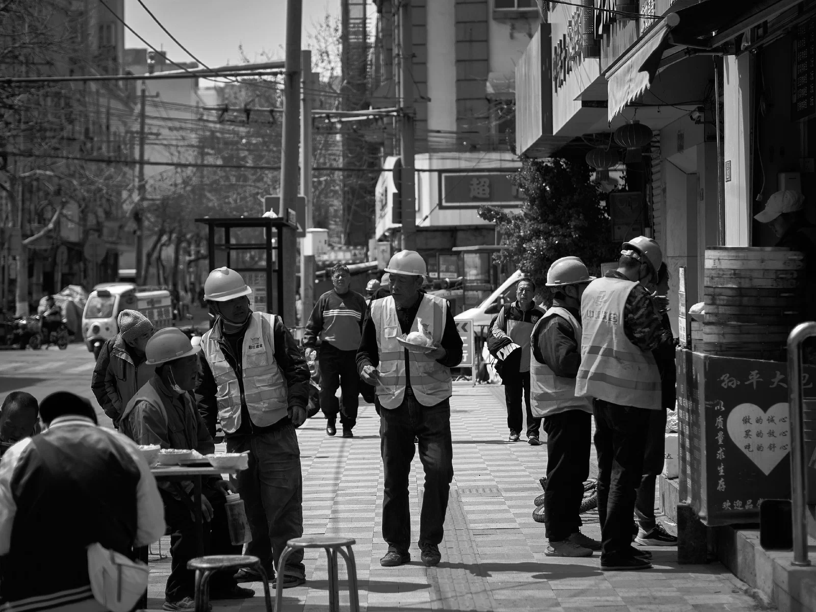 People and intersecting figures in the street