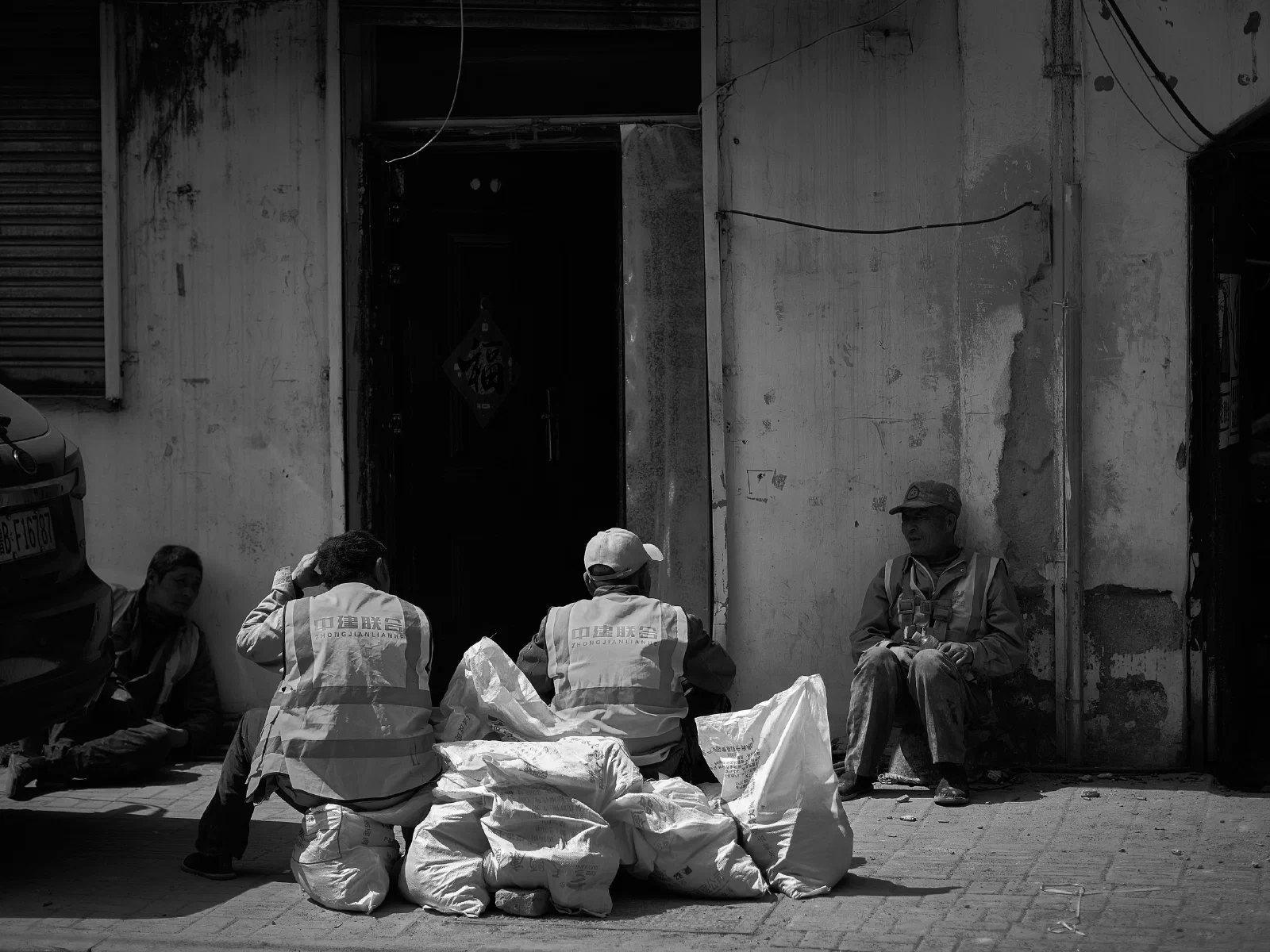 People and intersecting figures in the street