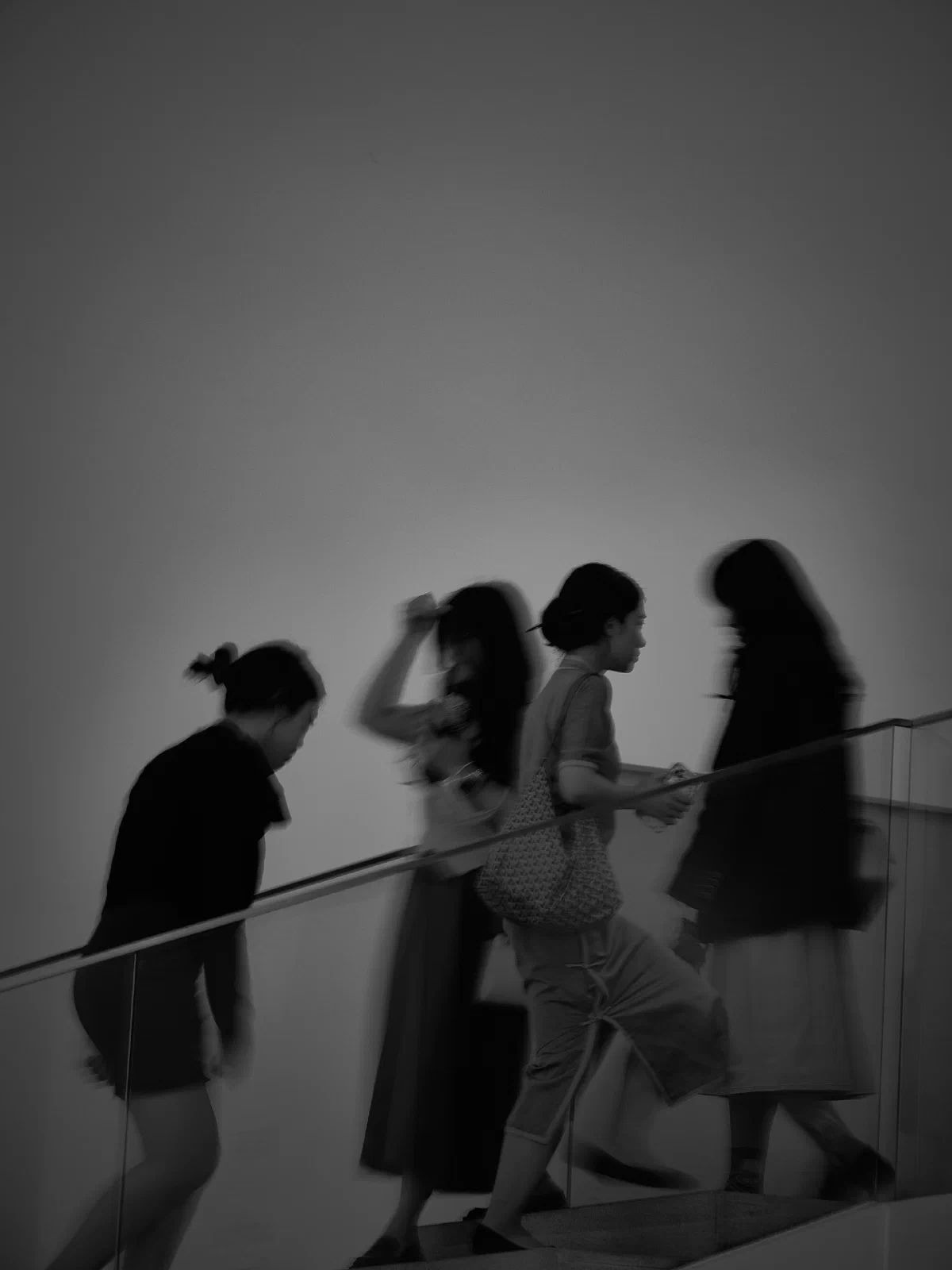 People and intersecting figures in the street