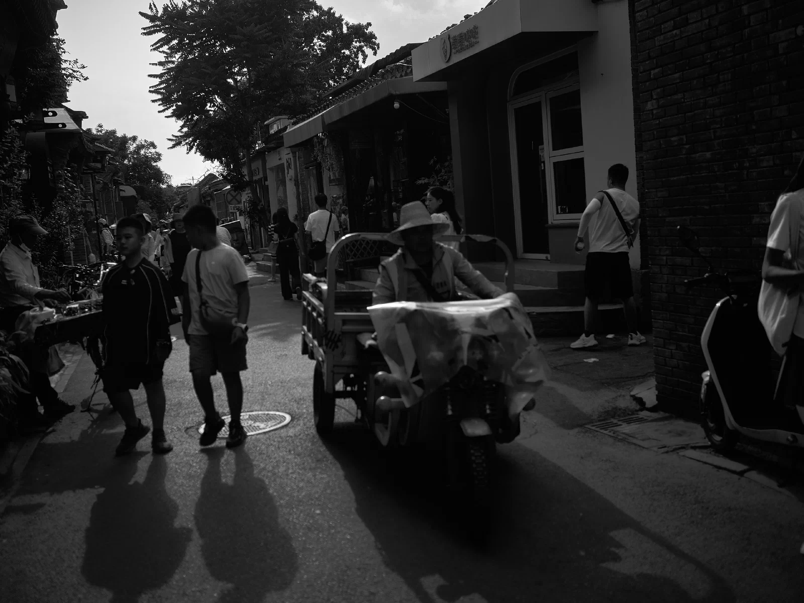 People and intersecting figures in the street