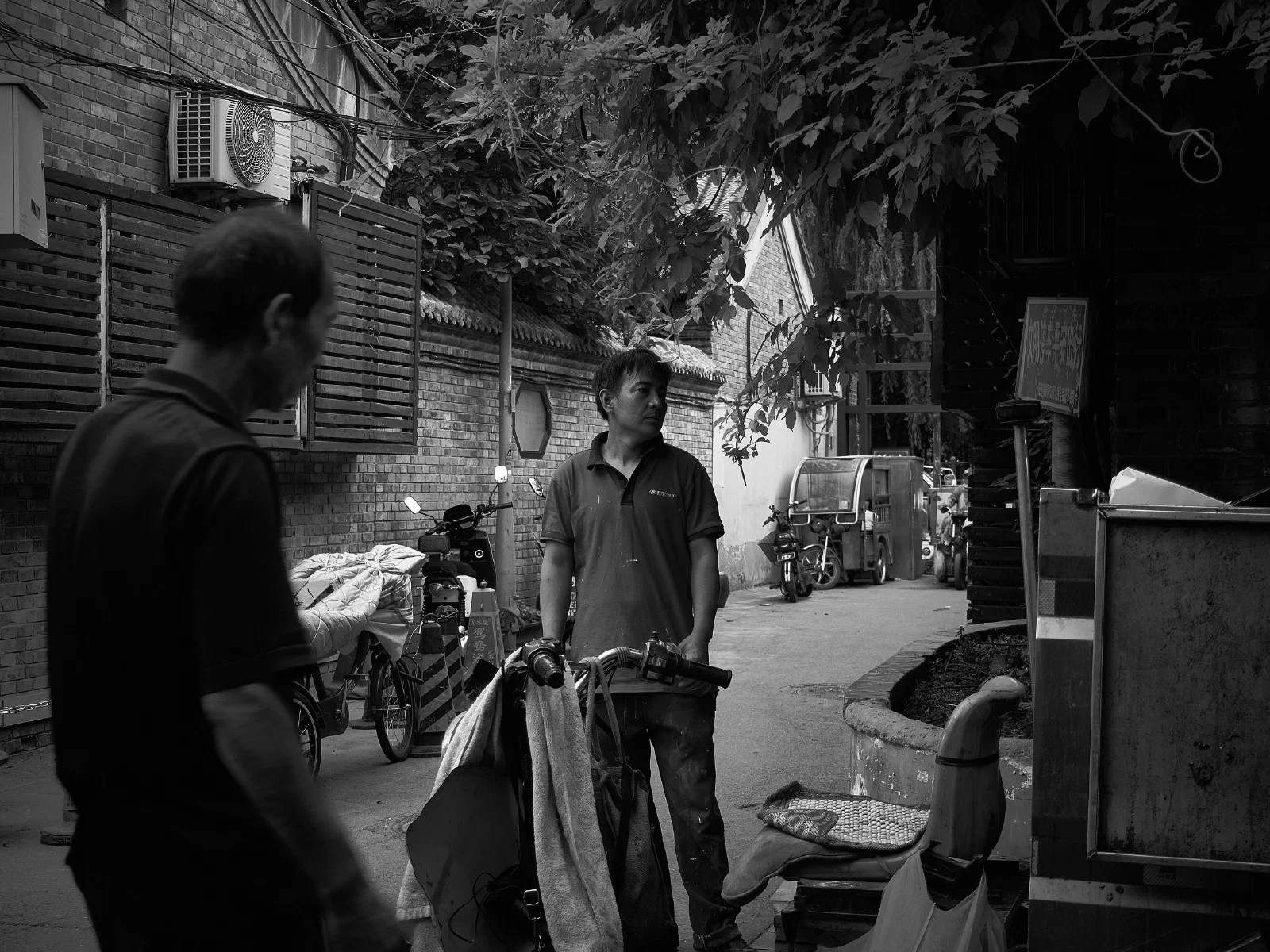 People and intersecting figures in the street