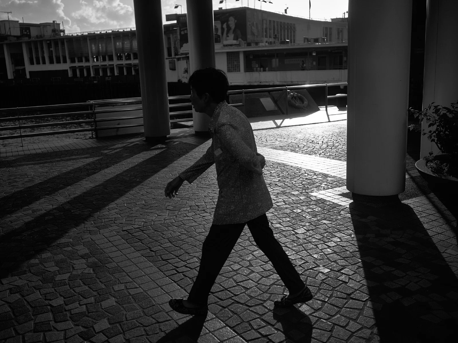 People and intersecting figures in the street