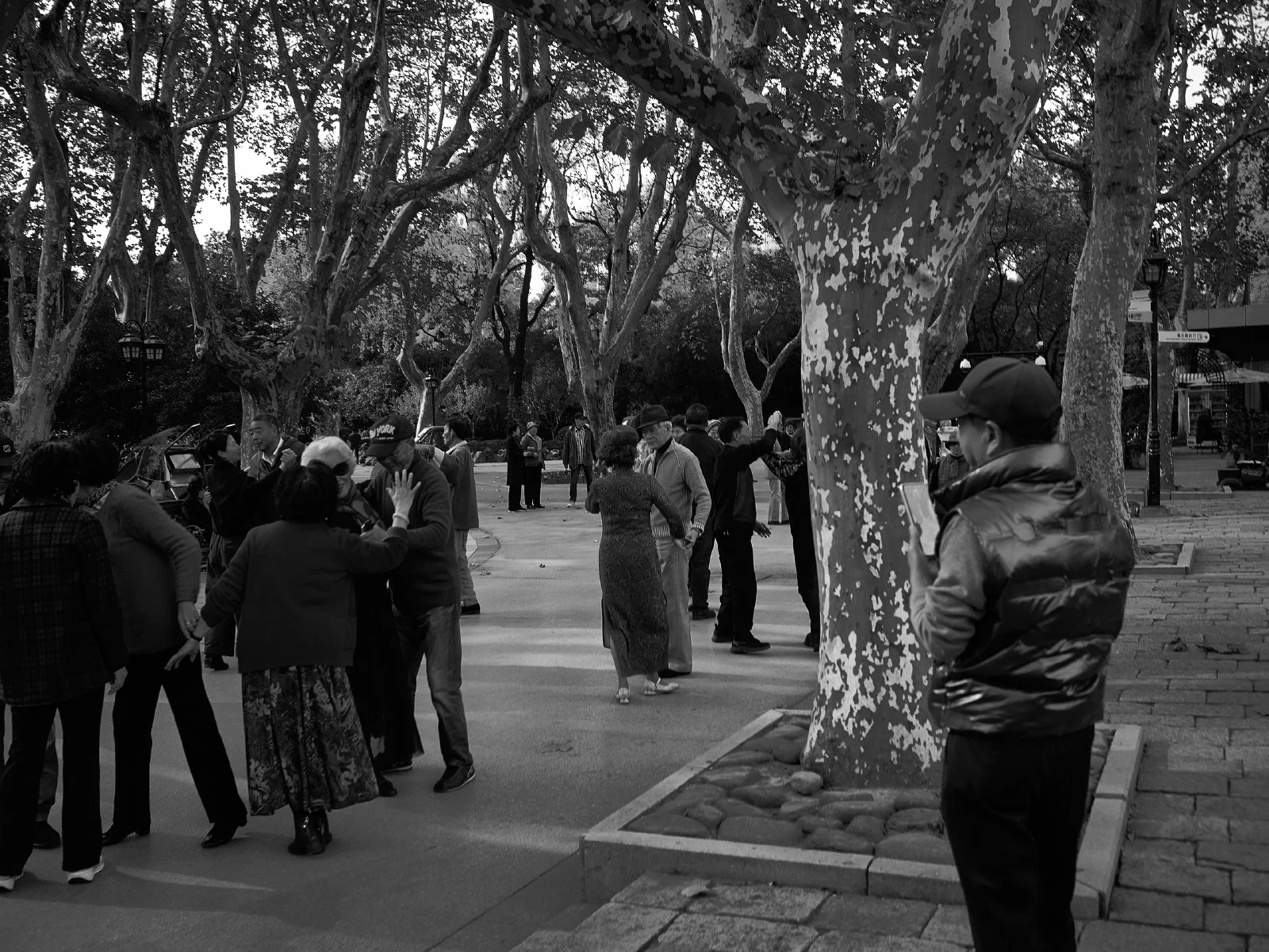 People and intersecting figures in the street