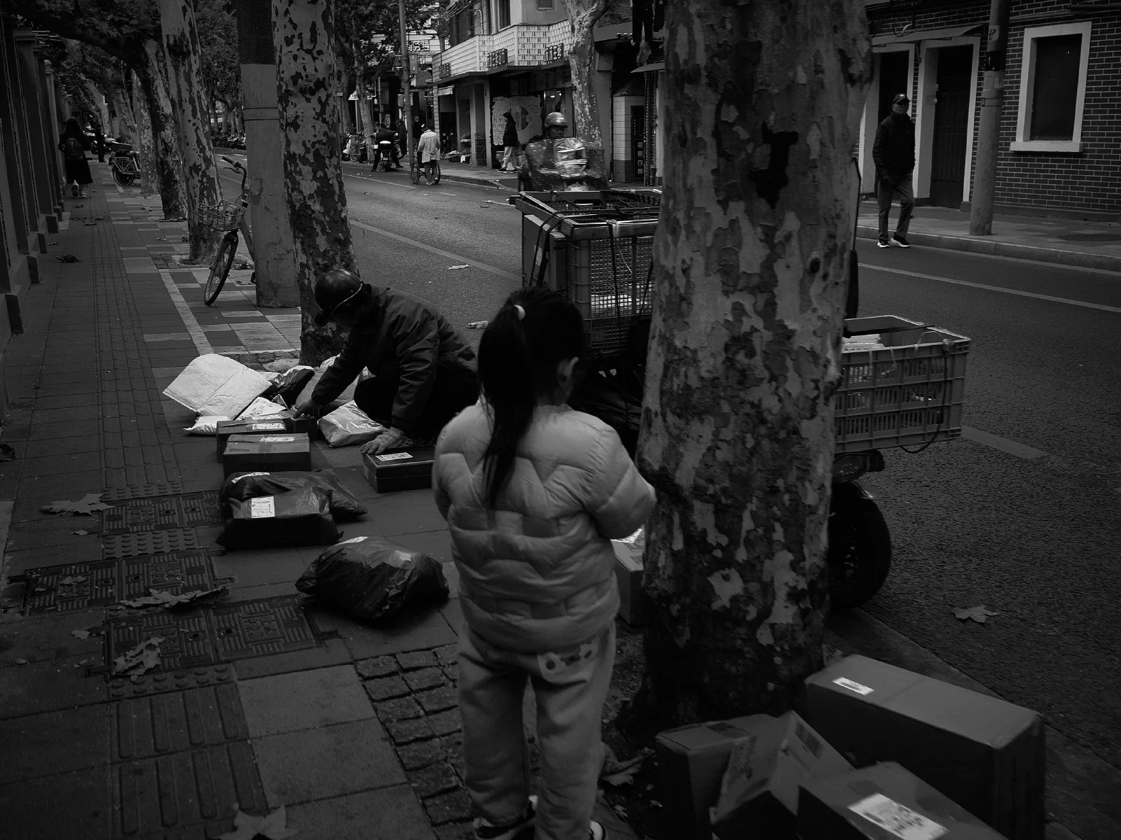 People and intersecting figures in the street