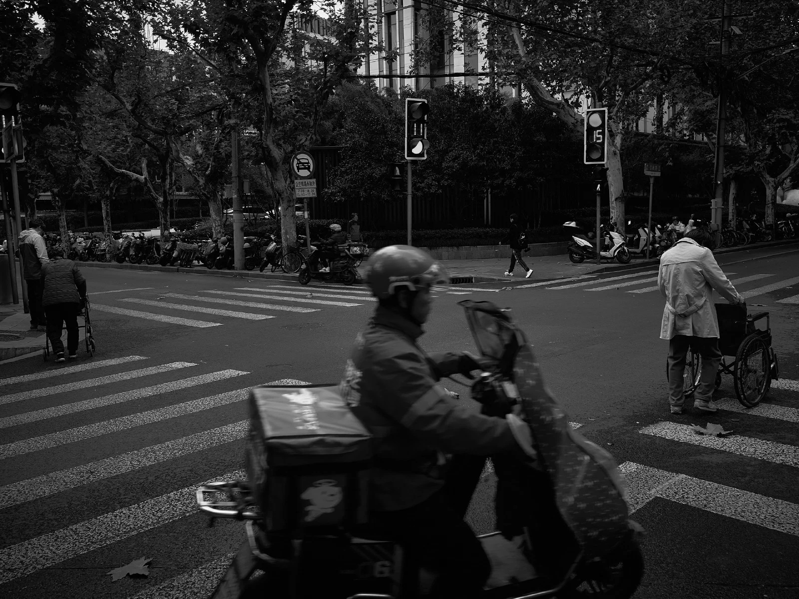 People and intersecting figures in the street