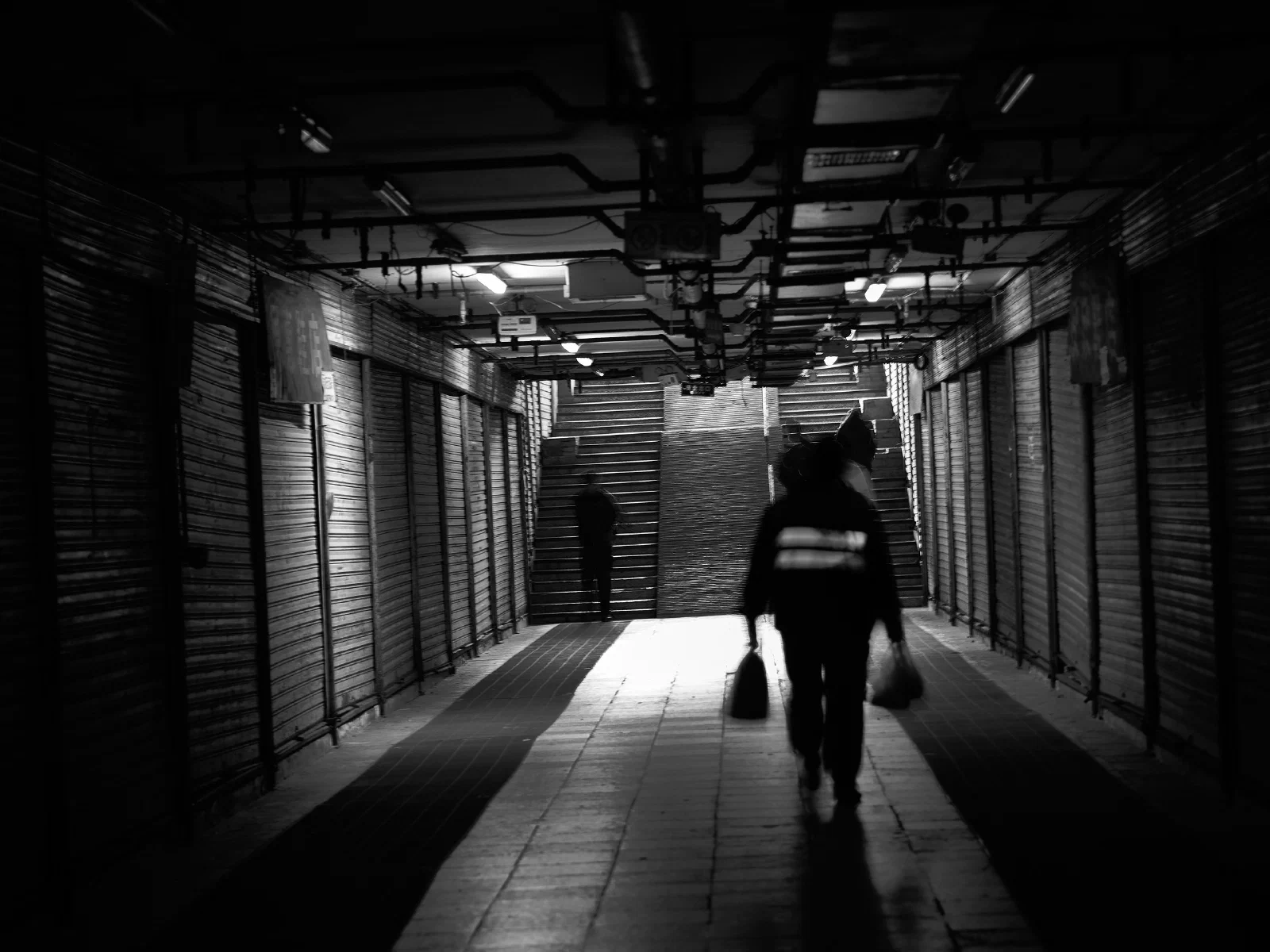 People and space at the meeting of light and shadow