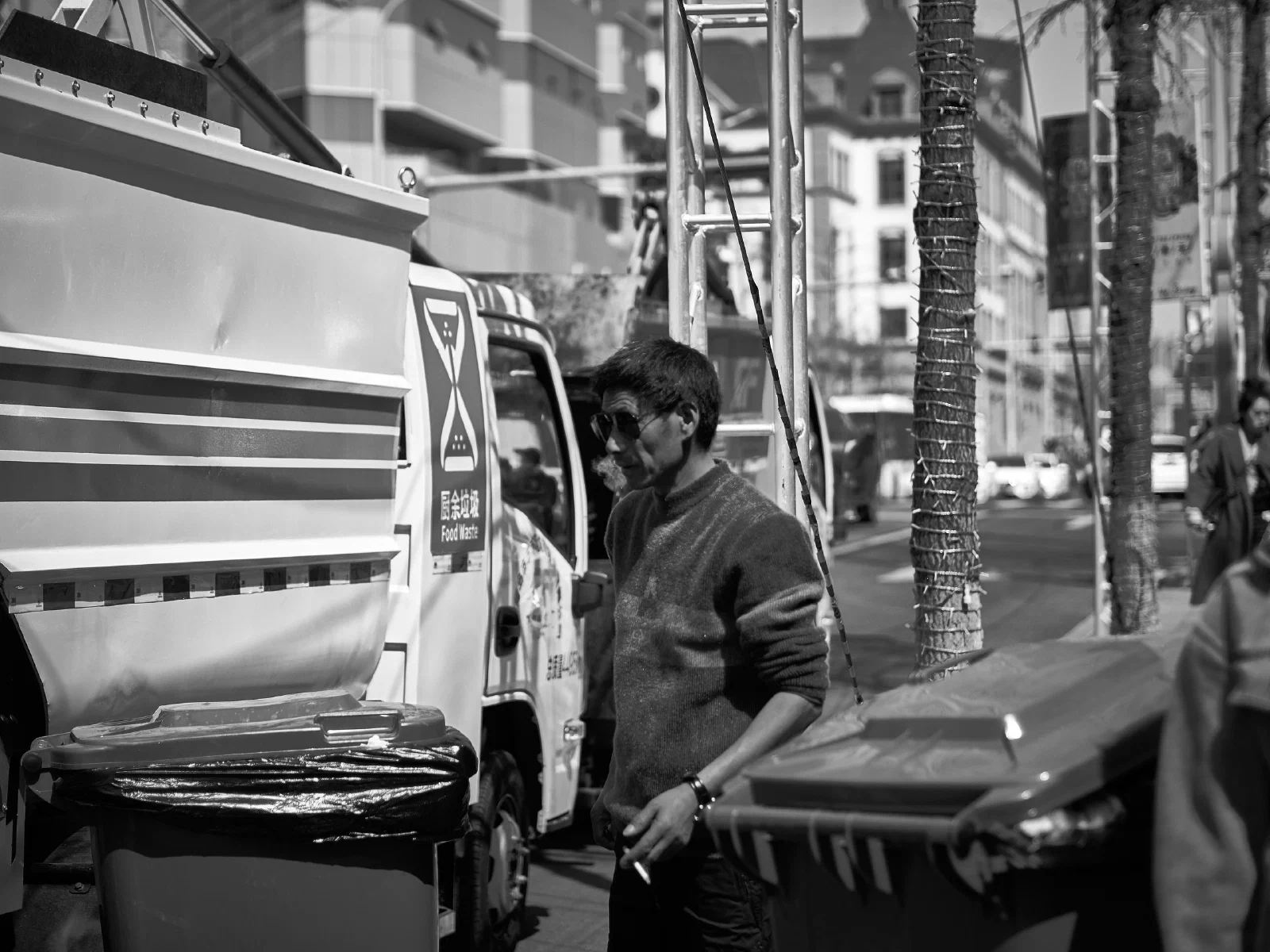 People and stalls by the street
