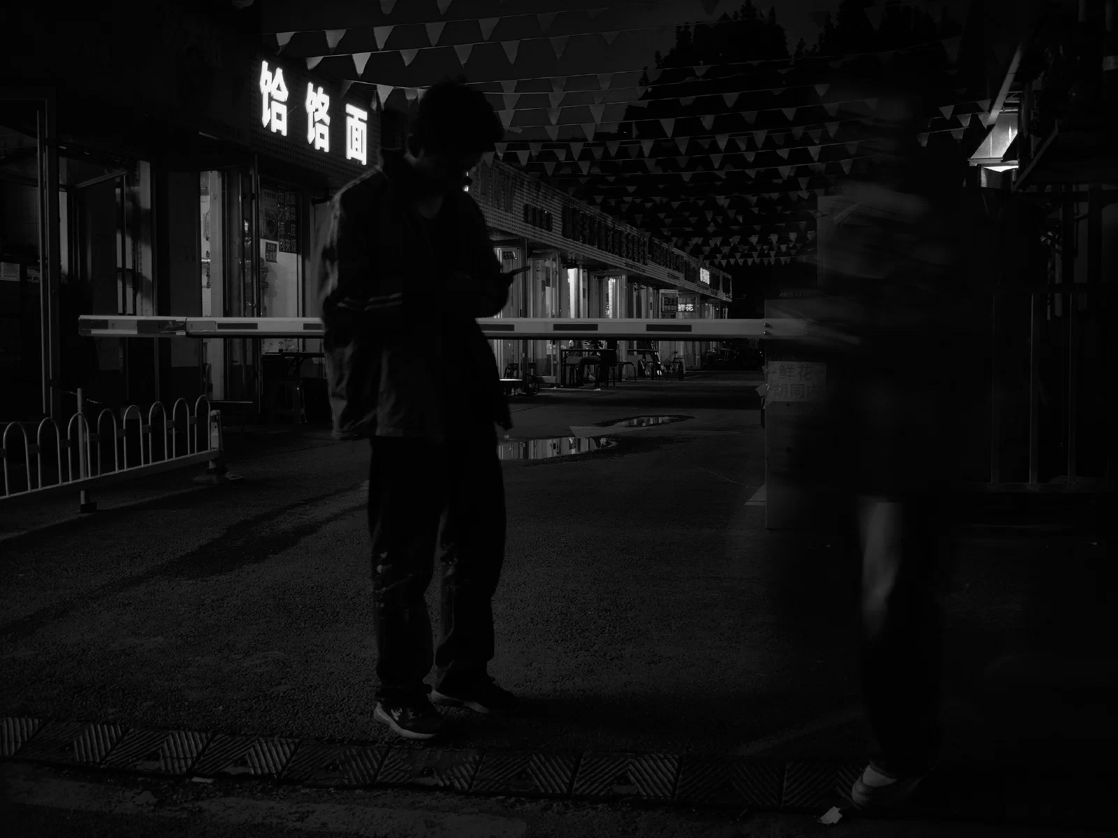 A solitary figure within a surrounding space