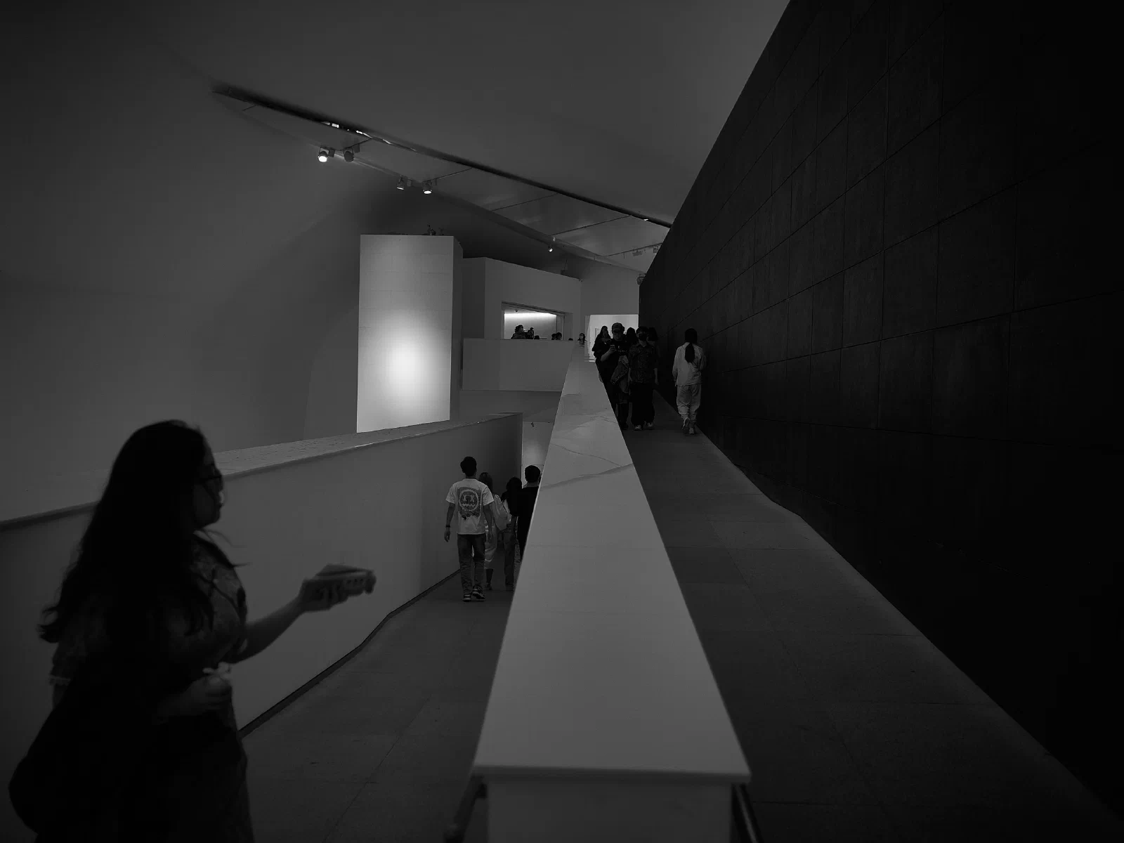 People and space at the meeting of light and shadow