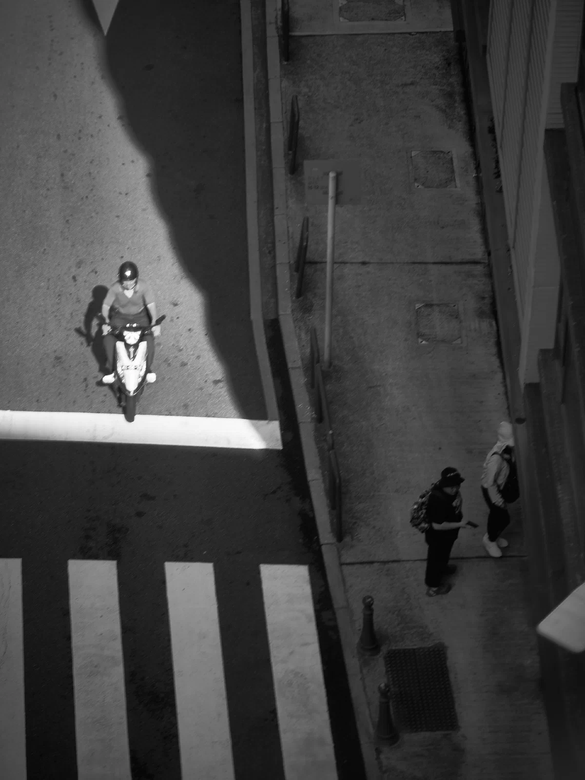 Cyclists and pedestrians seen from above.