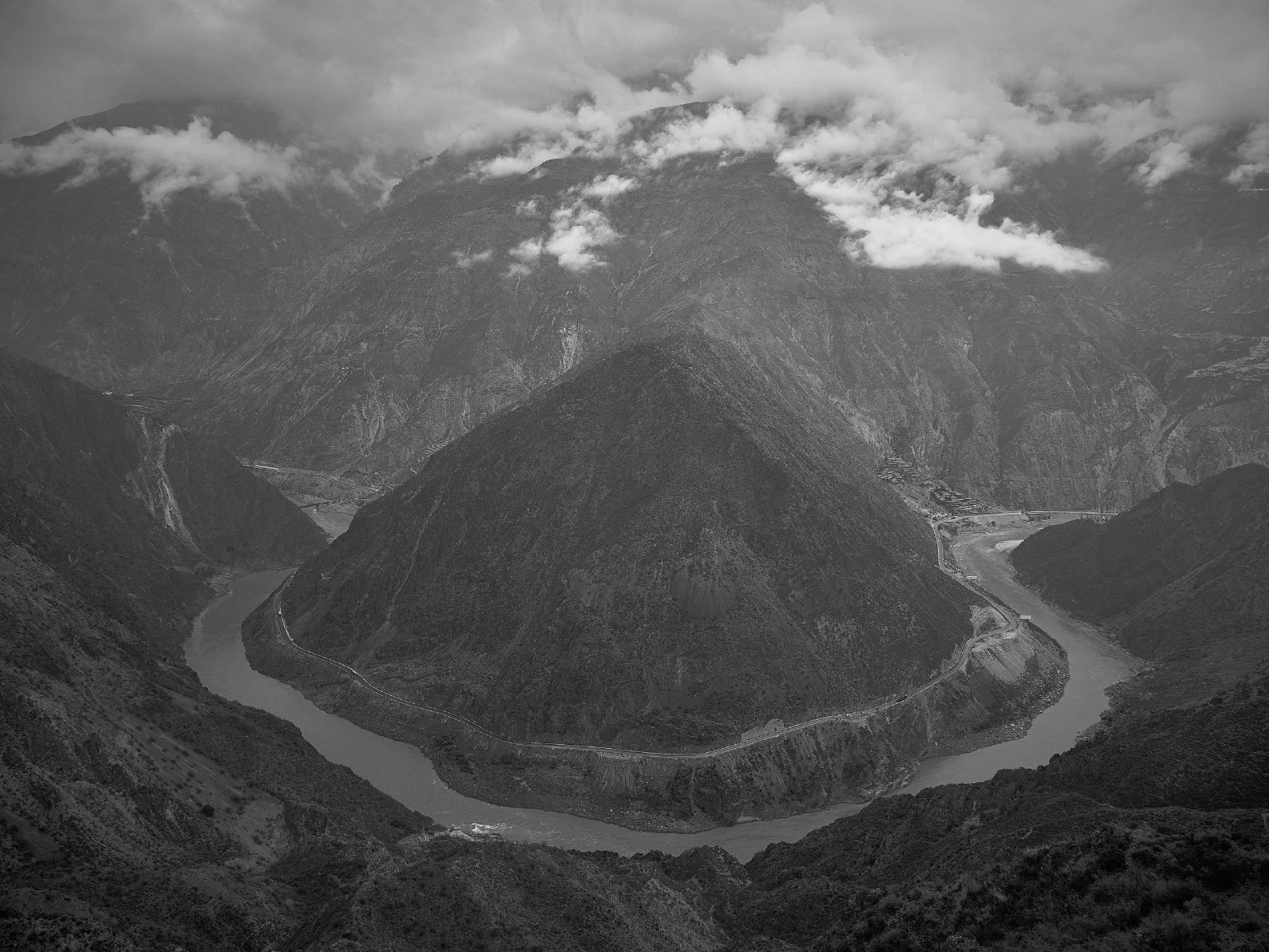 Mountains and valleys with buildings nearby