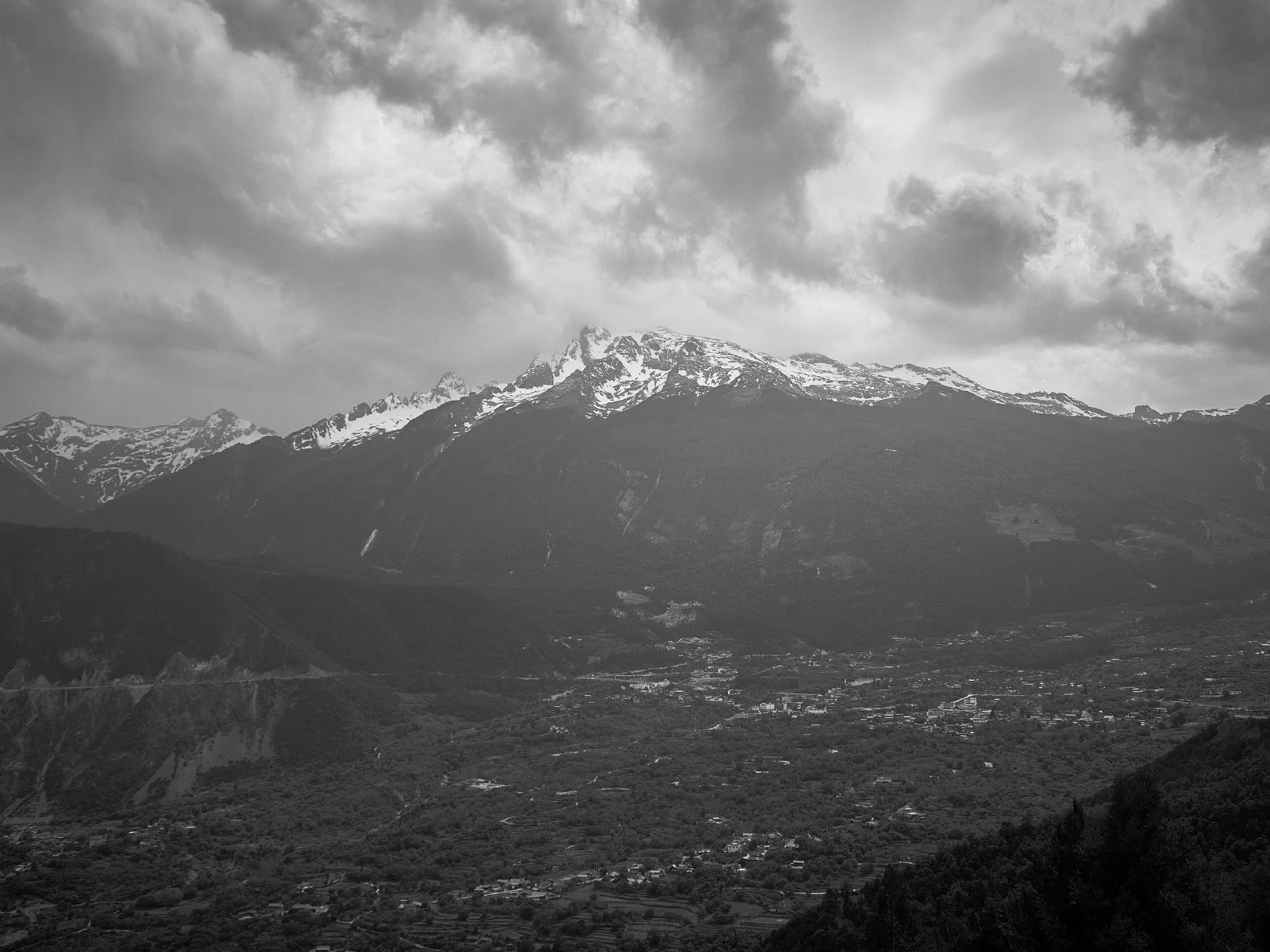 Mountains and valleys with buildings nearby